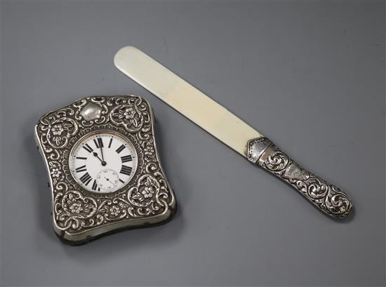 An Edwardian silver travelling watch case with goliath watch and a late Victorian silver handled ivory letter opener.